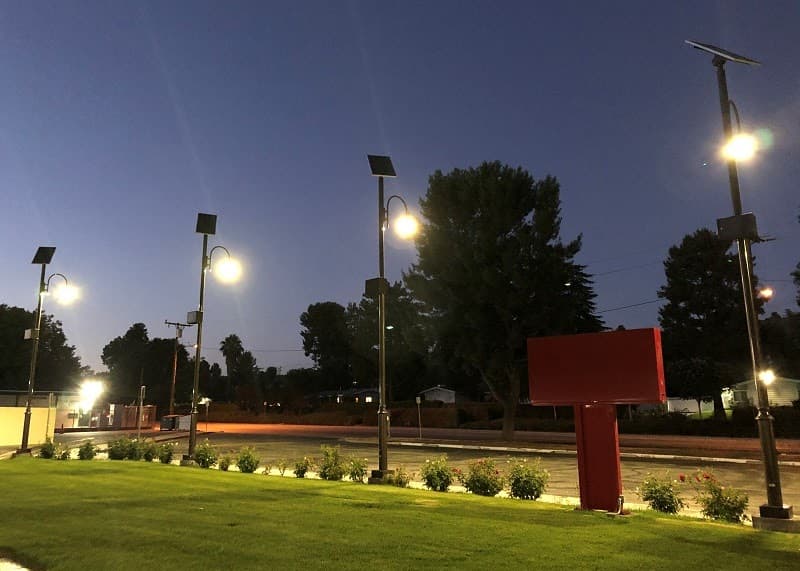Solar light fixture installed near a school building
